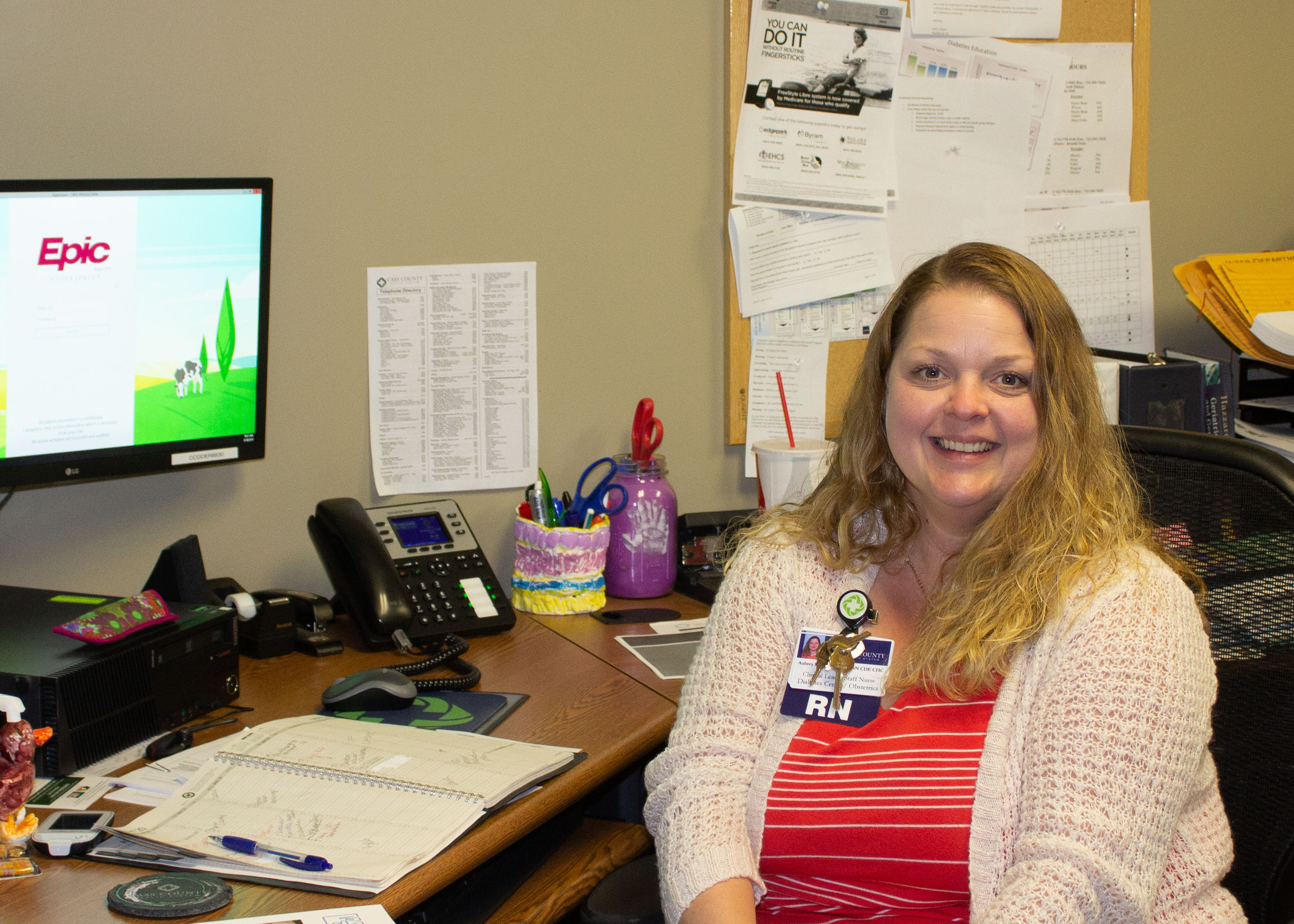 Aubrey Molegaard sitting at desk