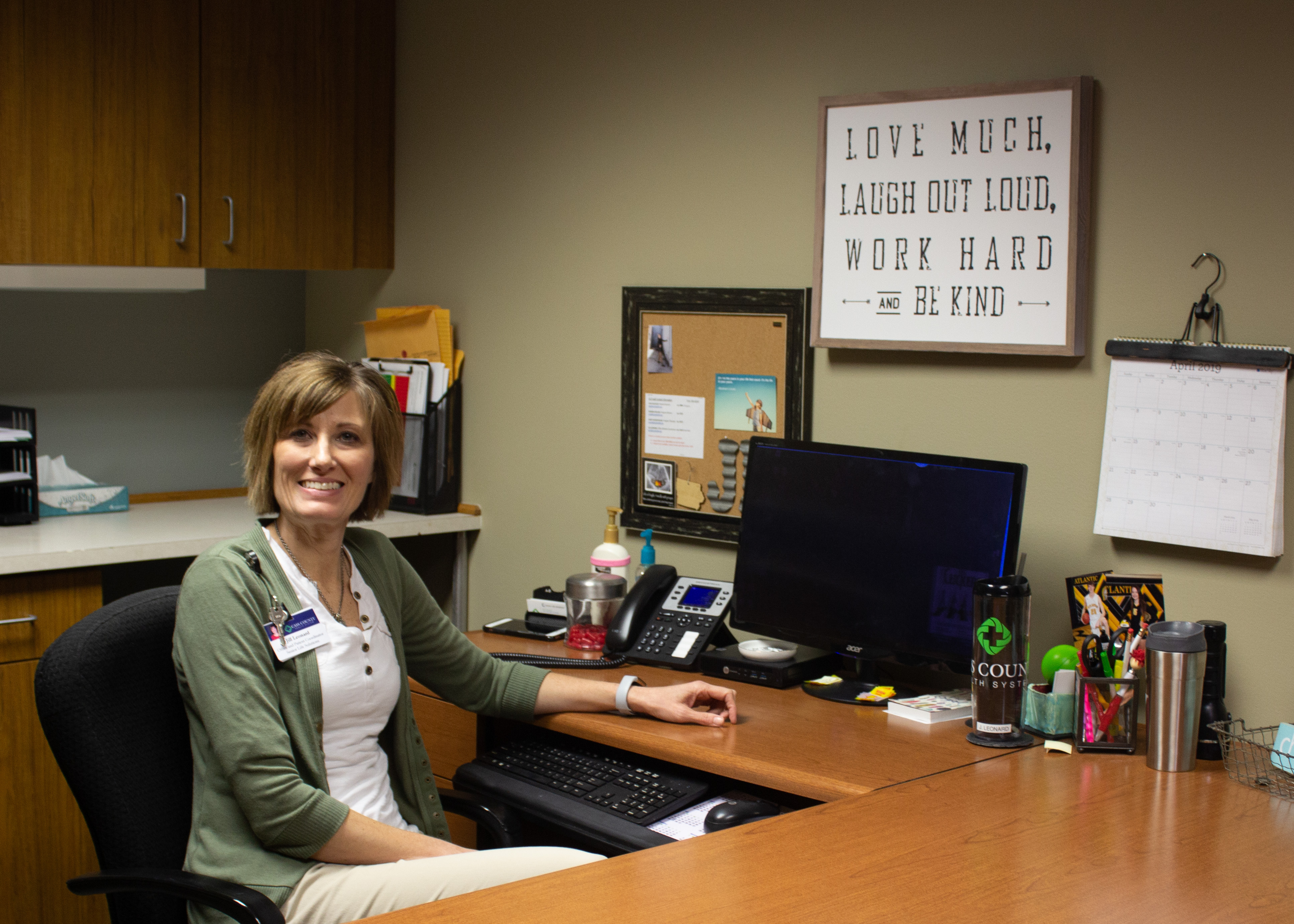 Jill Leonard sitting at desk