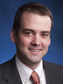 Dr. David Ingvoldstad wearing black jacked with copper tie