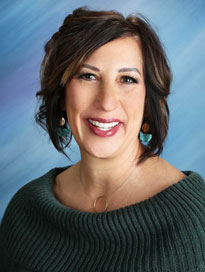 BeckyMcCann FNP Becky McCann wearing a green sweater