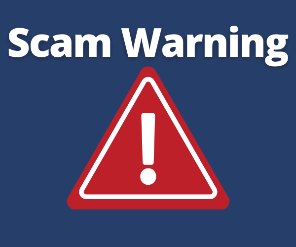 Scam Warning text with warning triangle sign.