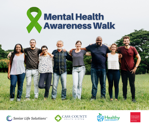 MHWalkFeatImage Diverse group standing in grass with arms around each other. text above says Mental Health Awareness walk, and sponsor logos under.